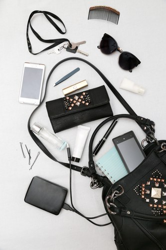 Numerous objects spilling out of purse