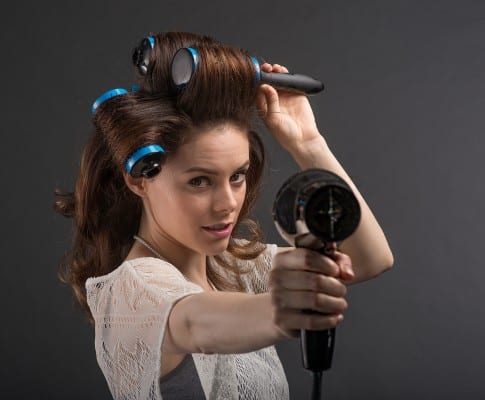 Model point hairdryer with Click n Curl in her hair