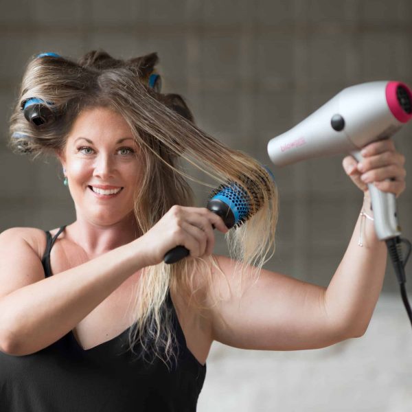 Model using Large Click n Curl Barrels while Hair-drying for an at home DIY Blowout style.