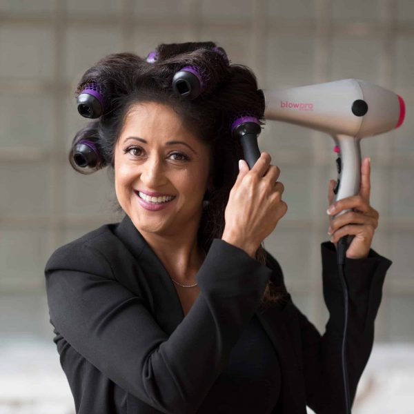 Model using Medium Click n Curl Barrels while Hair-drying for an at home DIY Blowout style.