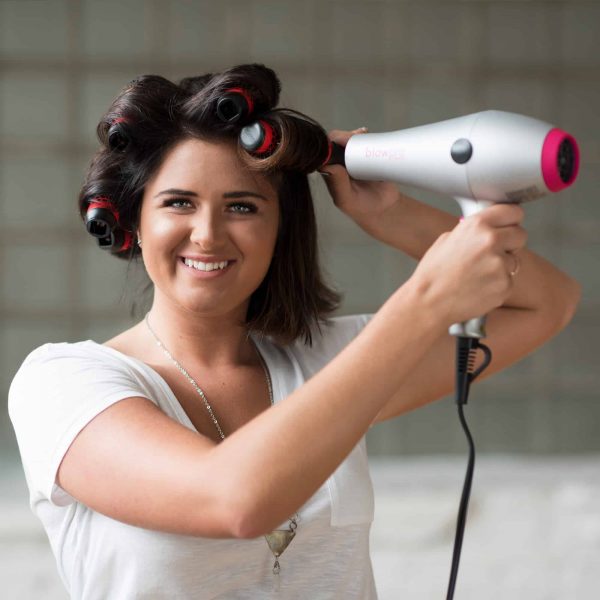 Model using Small Click n Curl Barrels while Hair-drying for an at home DIY Blowout style.