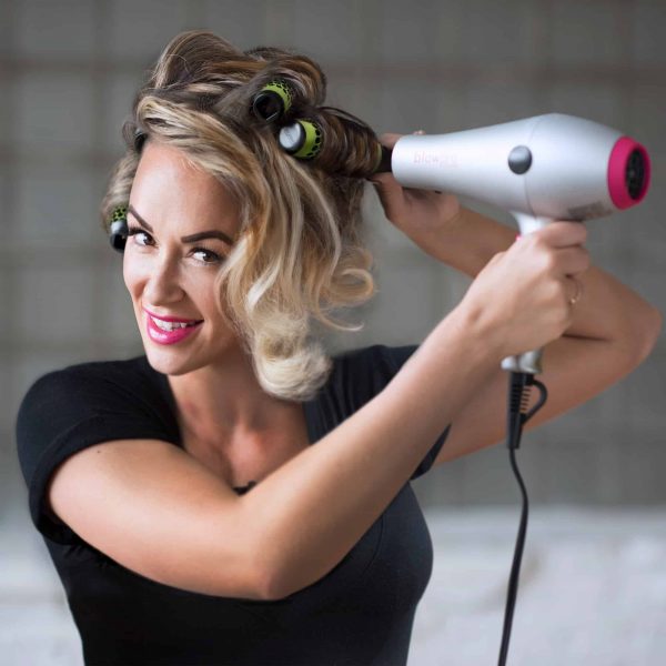 Model using Extra Small Click n Curl Barrels while Hair-drying for an at home DIY Blowout style.